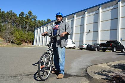 Lamont Burt rides his bike to work at the Library Service Center as often as he can. Photo by Bryan Roth.