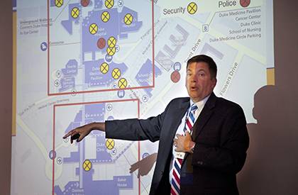 John Dailey, chief of Duke Police, explains aspects of his department during a 
