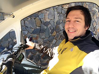 Graduate student Isaac Hacerola poses for a photo in an ELF, a bike-electric hybrid that will be awarded to him and two others as the grand prize in Duke's Unpark Yourself Challenge. Photo courtesy of Isaac Hacerola.