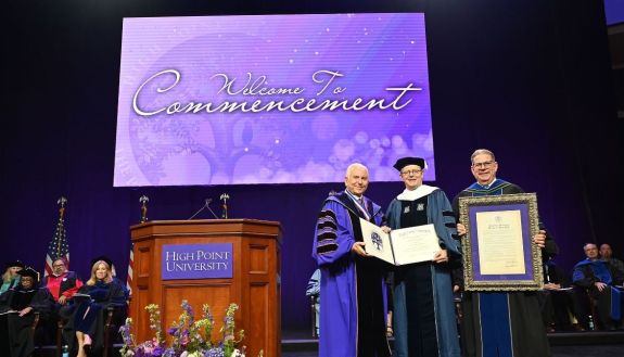 High Point President Nido Qubein presented an honorary Doctor of Humane Letters degree to Dr. Vincent Price, president of Duke University and the Graduate Commencement speaker. They were joined by HPU Provost Daniel Erb.
