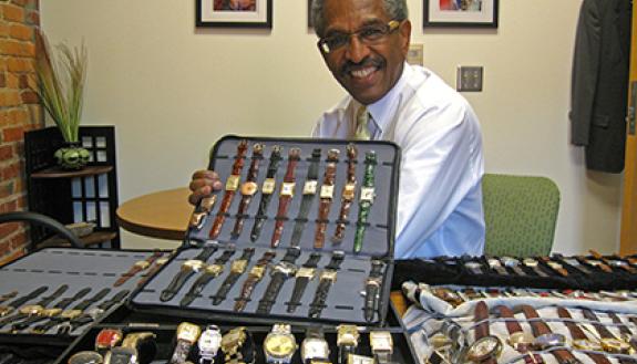Benjamin D. Reese, Jr. Duke's vice president for Institutional Equity, with some of the more than 100 wristwatches he has collected. Photo by Marsha A. Green.