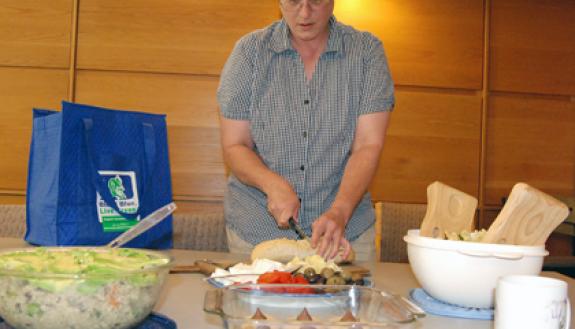 Leslie Pardue prepares food for July's "Meatless Monday" lunch.