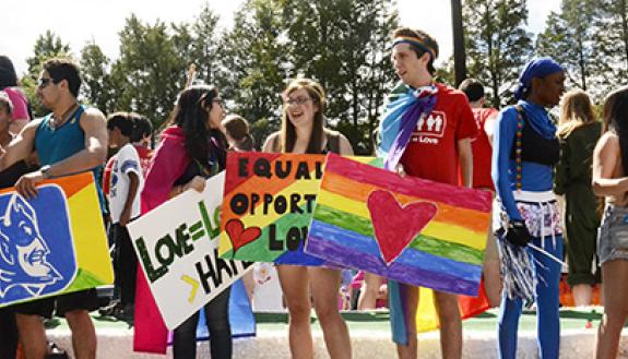 Members of the Duke community march with Duke's parade float during the 2013 N.C. Pride Parade. Photo courtesy of the Duke Center for Sexual and Gender Diversity