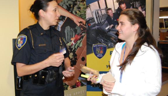 Lt. Shannan Tiffin disusses safety tips with a first-year student during last year's "Tips 'n Treats" session at the East Campus Marketplace. This month's Tips 'n Treats begin Oct. 17.