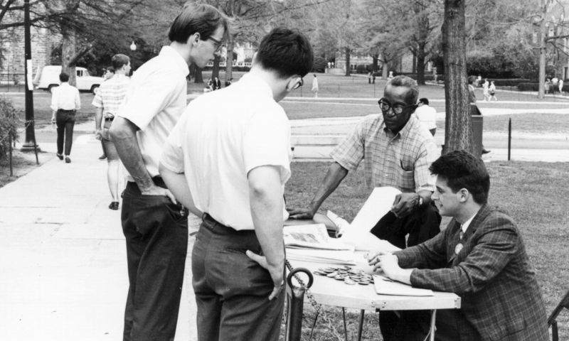Duke employee J. Oliver Harvey hands out information on campus in 1967. Photo by Bill Boyarsky, courtesy of the Durham County Library's North Carolina Collection.